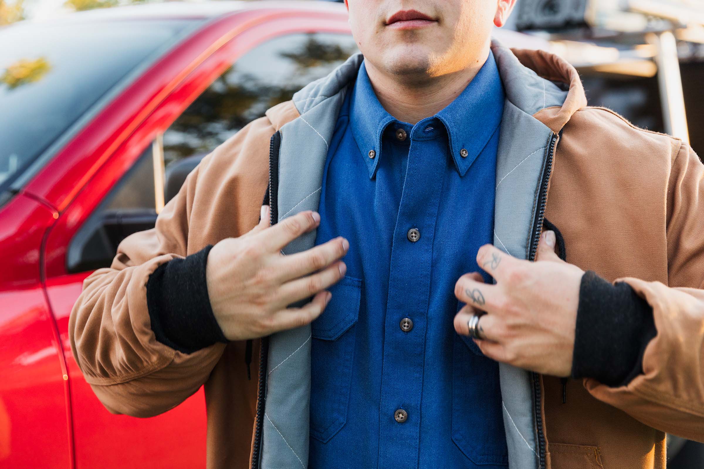 Electrical contractor putting on an FR jacket on the way to work.              